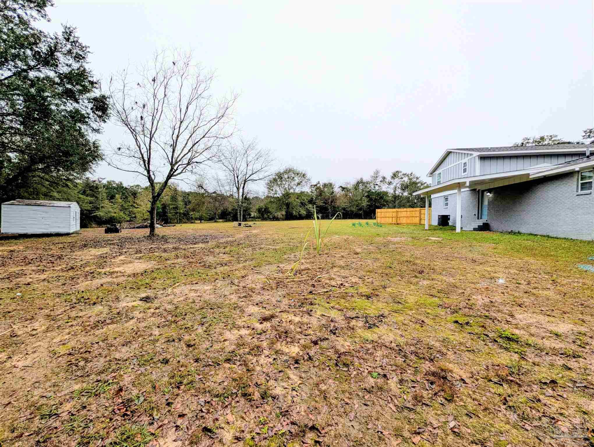 222 Santa Rosa Road Cantonment, FL 32533 - Photo 42 of 48 a view of swimming pool with an outdoor space and seating area