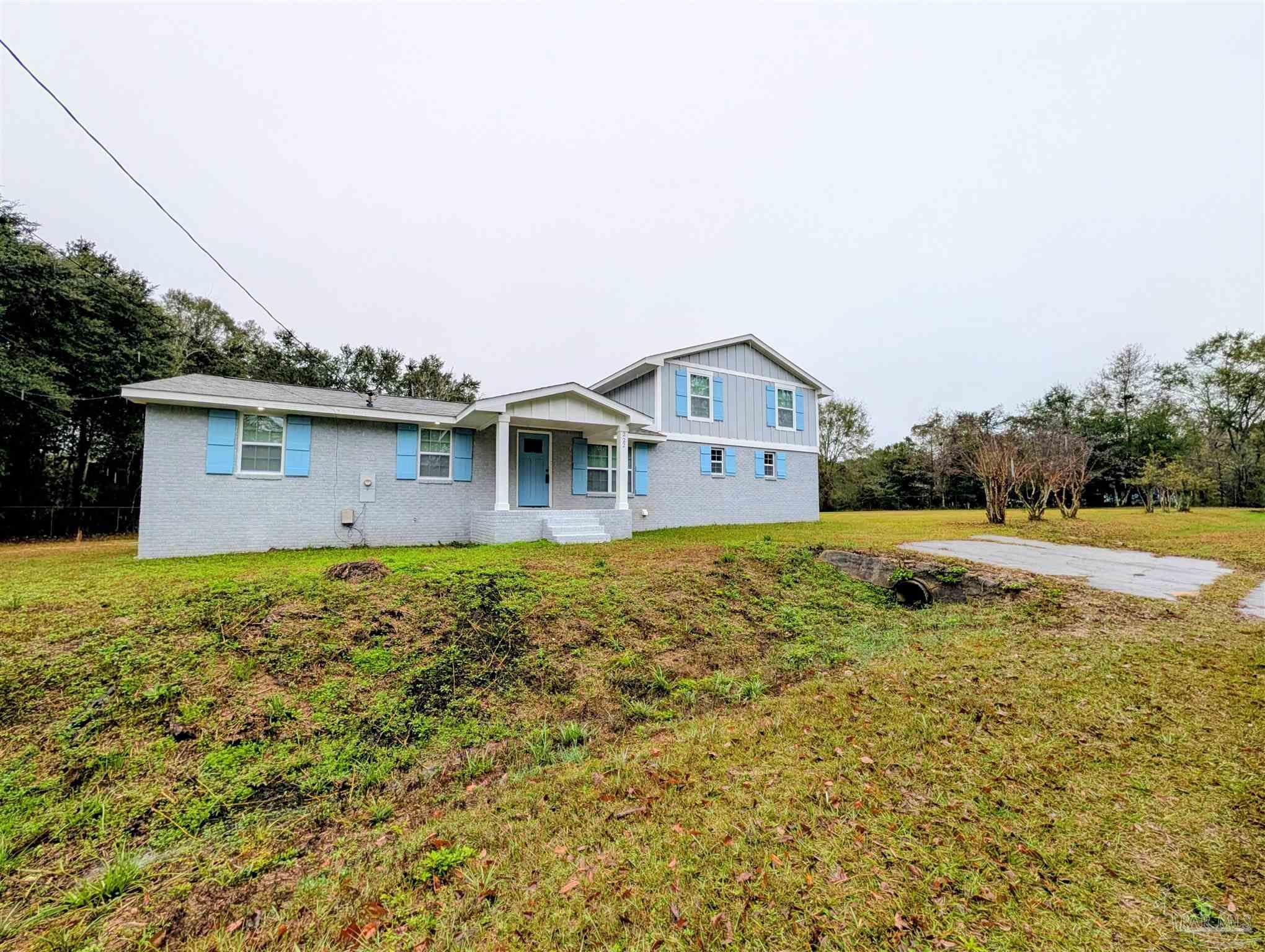 222 Santa Rosa Road Cantonment, FL 32533 - Photo 43 of 48 a view of a house with pool and sitting area