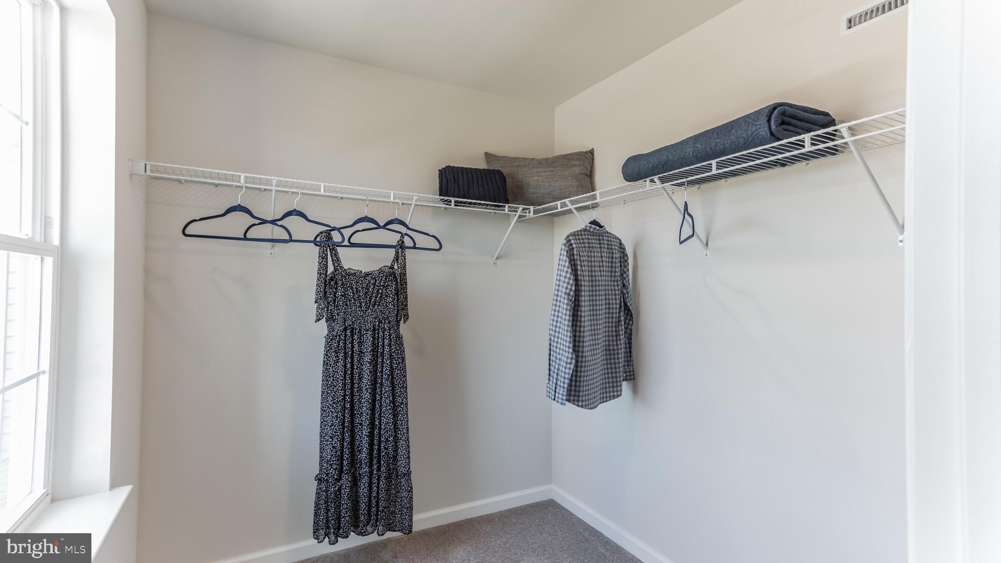 7 Eleanor Lane Roosevelt, NJ 08555 - Photo 15 of 19 a view of walk in closet with clothes and shoes