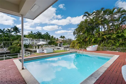 a view of a swimming pool with a lounge chair