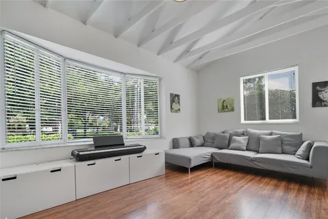a living room with furniture and windows