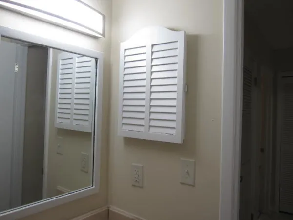 an empty room with wooden floor and door
