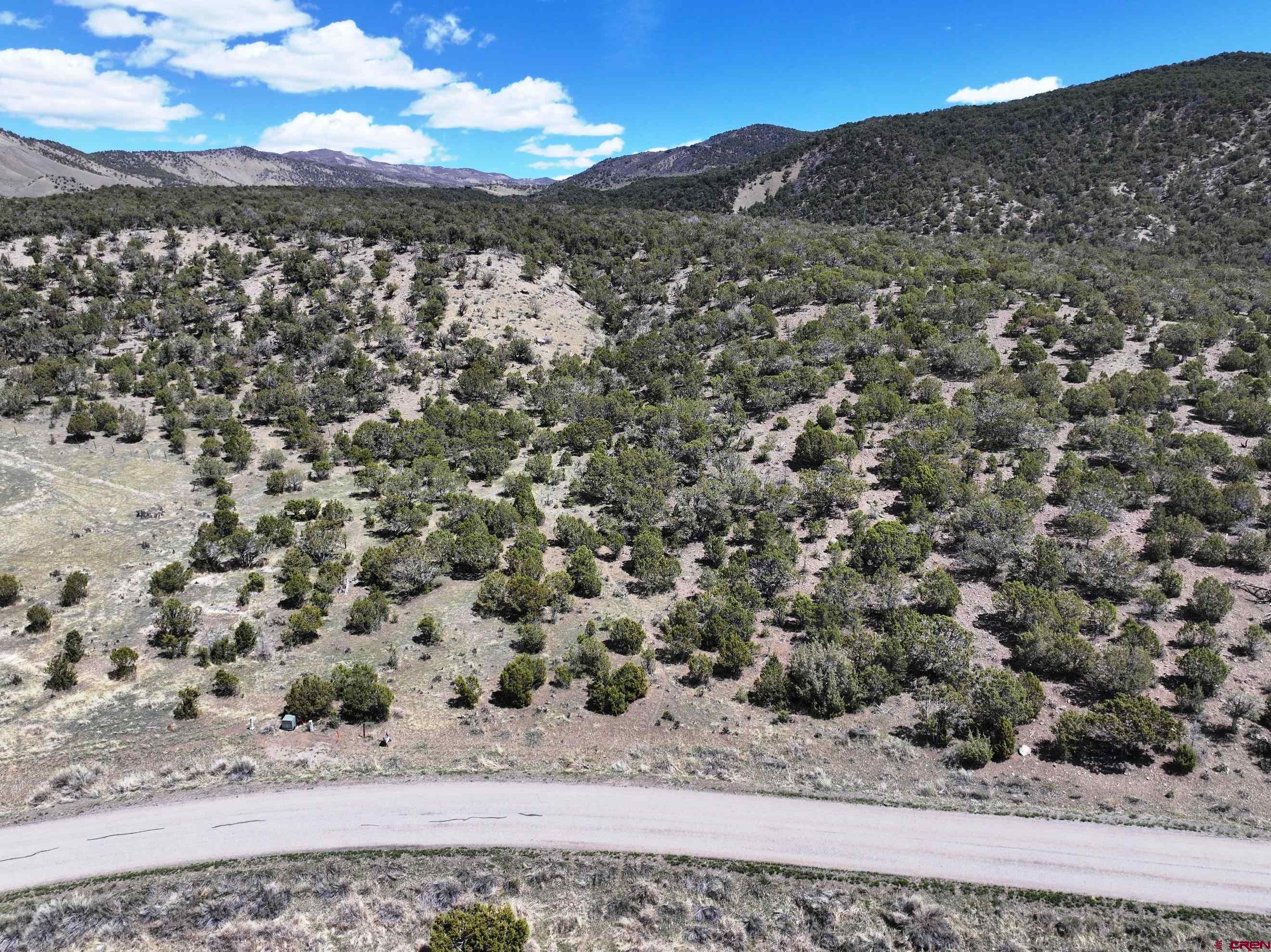 Tbd (lot 10 7250th Road Montrose, CO 81403 - Photo 5 of 22 a view of a field with a mountain in the background