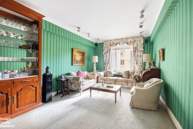 a spacious bathroom with a sink and a mirror