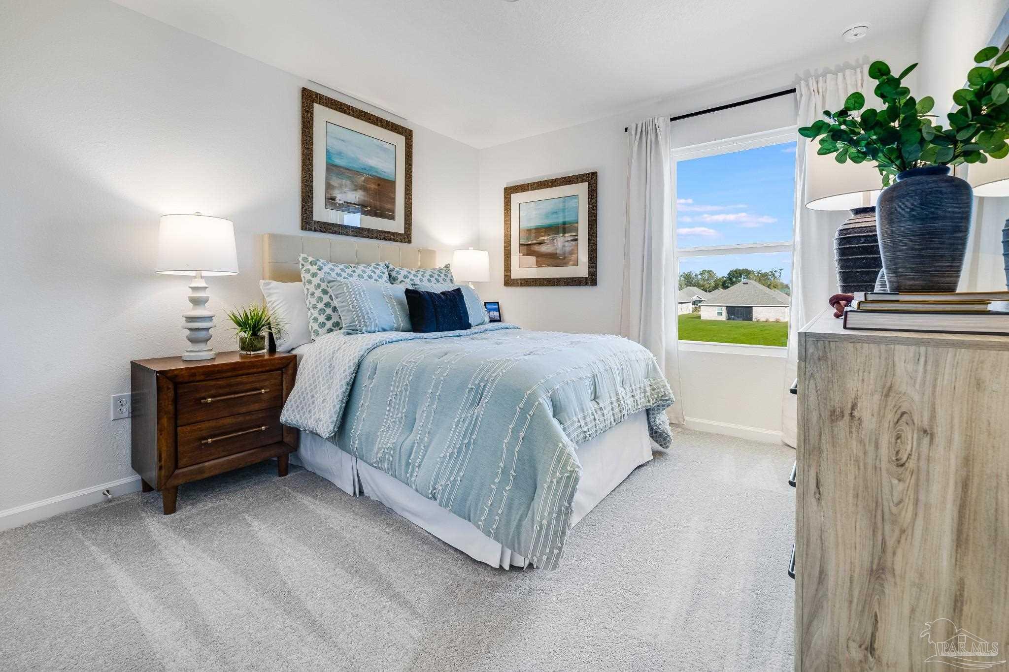 5380 Azimuth Way Milton, FL 32583 - Photo 41 of 53 a bedroom with a bed dresser and a window