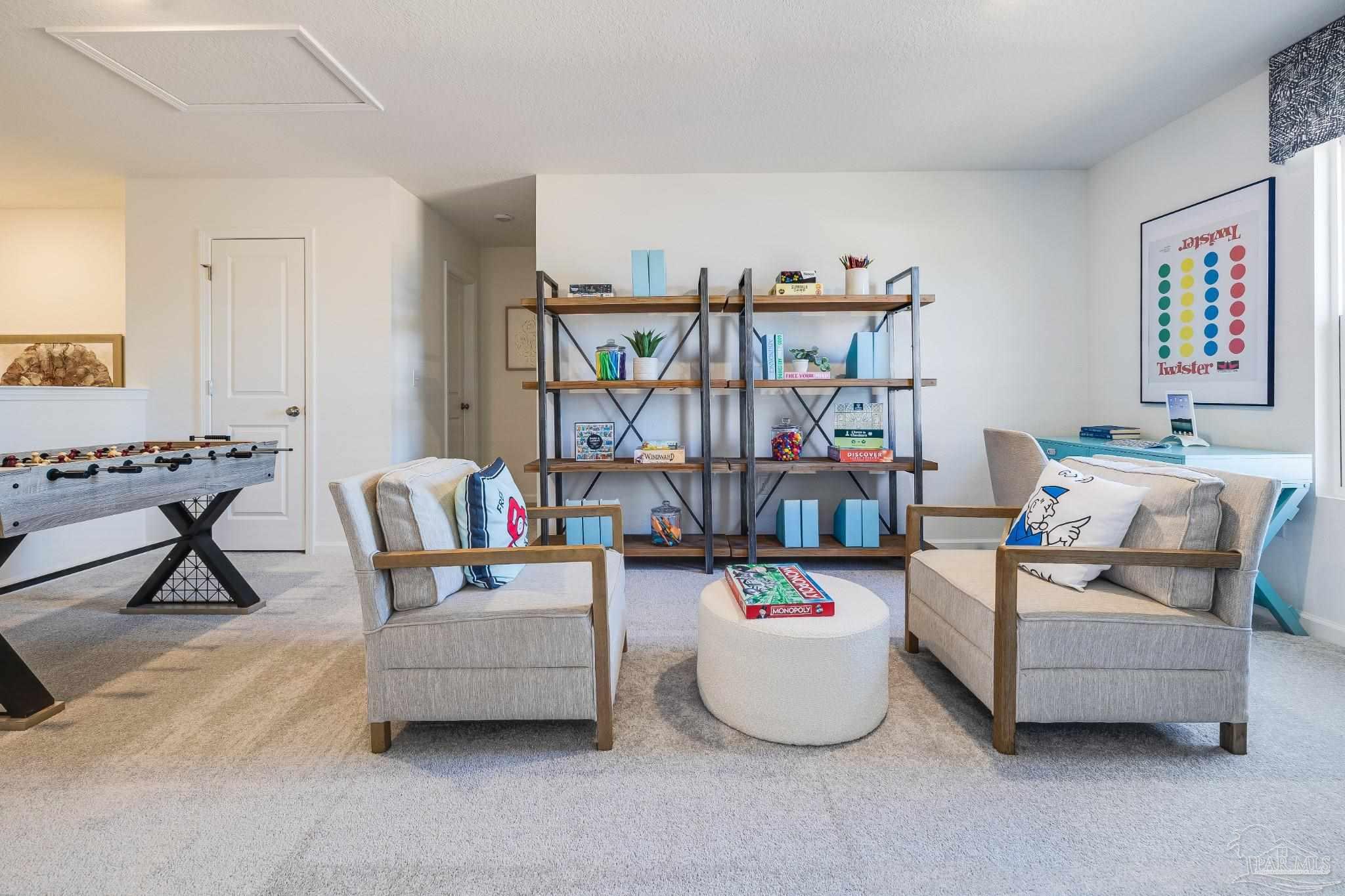 5380 Azimuth Way Milton, FL 32583 - Photo 47 of 53 a living room with furniture and a book shelf