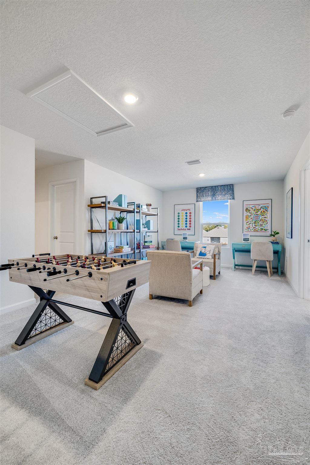 5380 Azimuth Way Milton, FL 32583 - Photo 51 of 53 a room with furniture gym equipment and a window