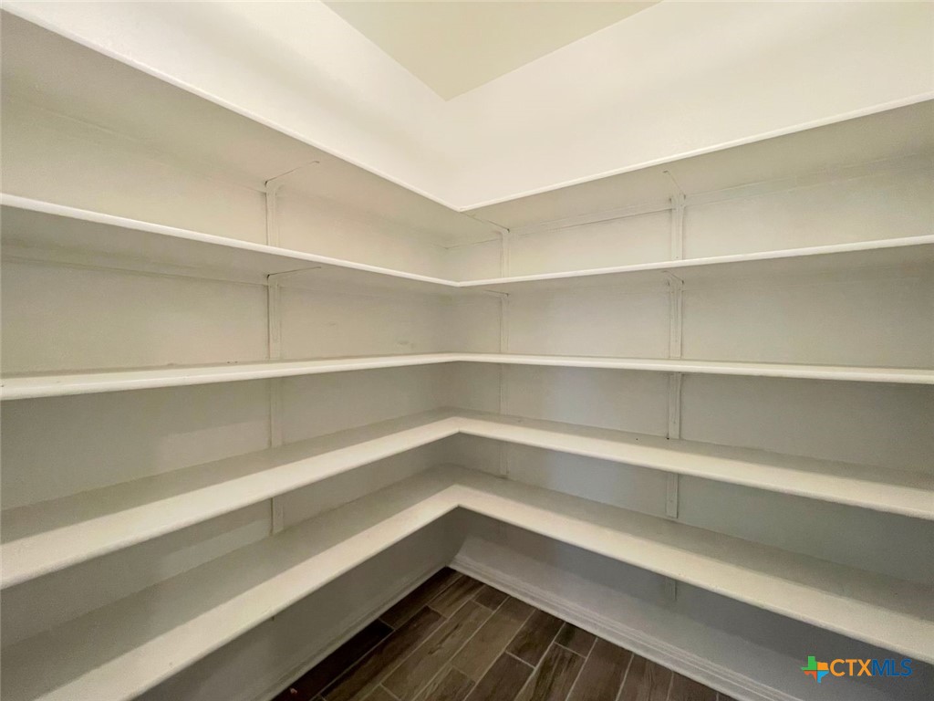 108 Old Stagecoach Road Jarrell, TX 76537 - Photo 11 of 45 a storage room with wooden floor