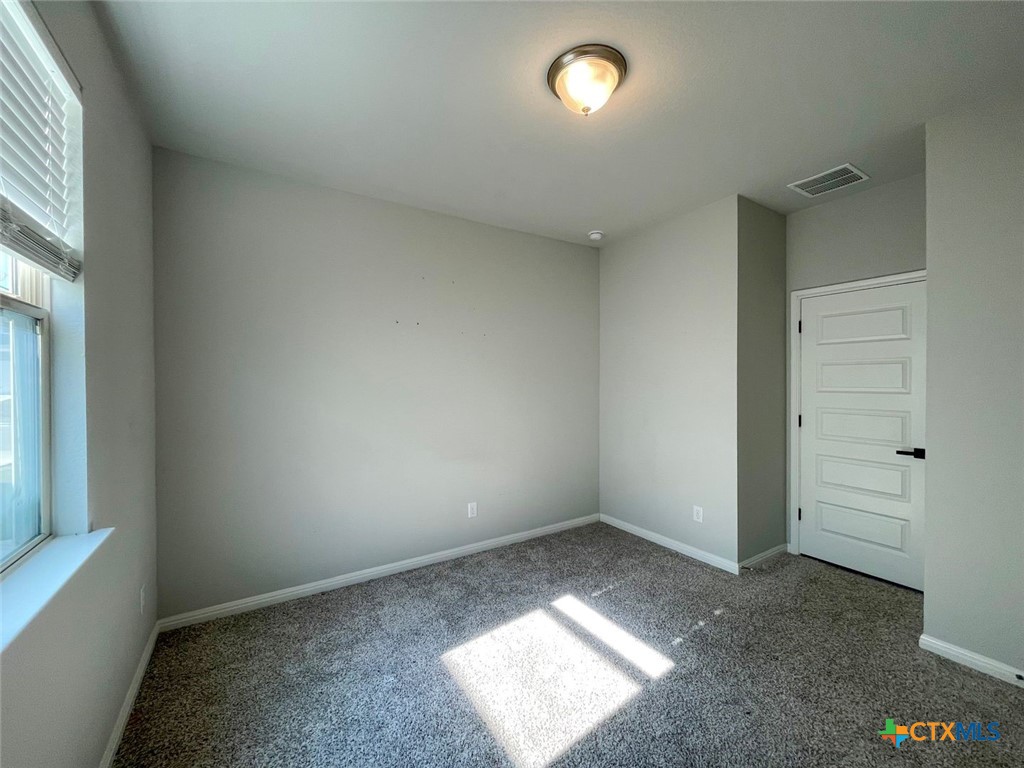 108 Old Stagecoach Road Jarrell, TX 76537 - Photo 12 of 45 an empty room with windows