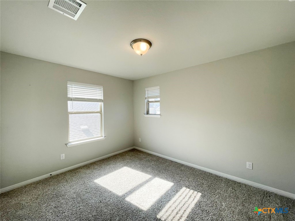 108 Old Stagecoach Road Jarrell, TX 76537 - Photo 13 of 45 an empty room with a window