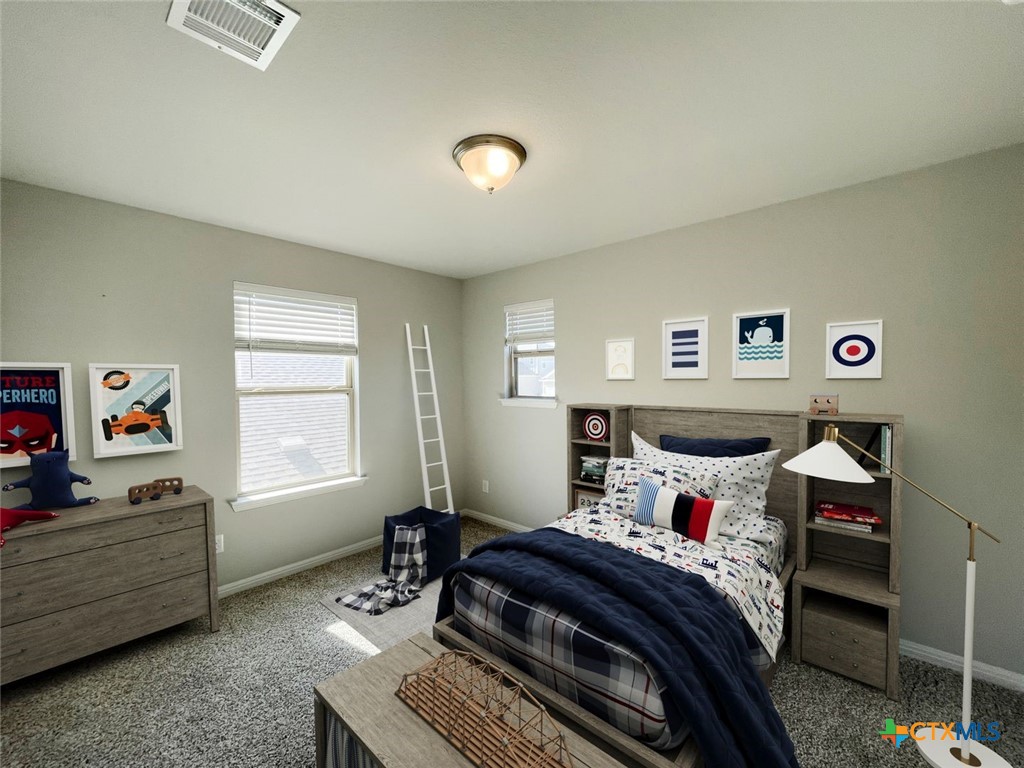 108 Old Stagecoach Road Jarrell, TX 76537 - Photo 14 of 45 a bedroom with a bed and a window