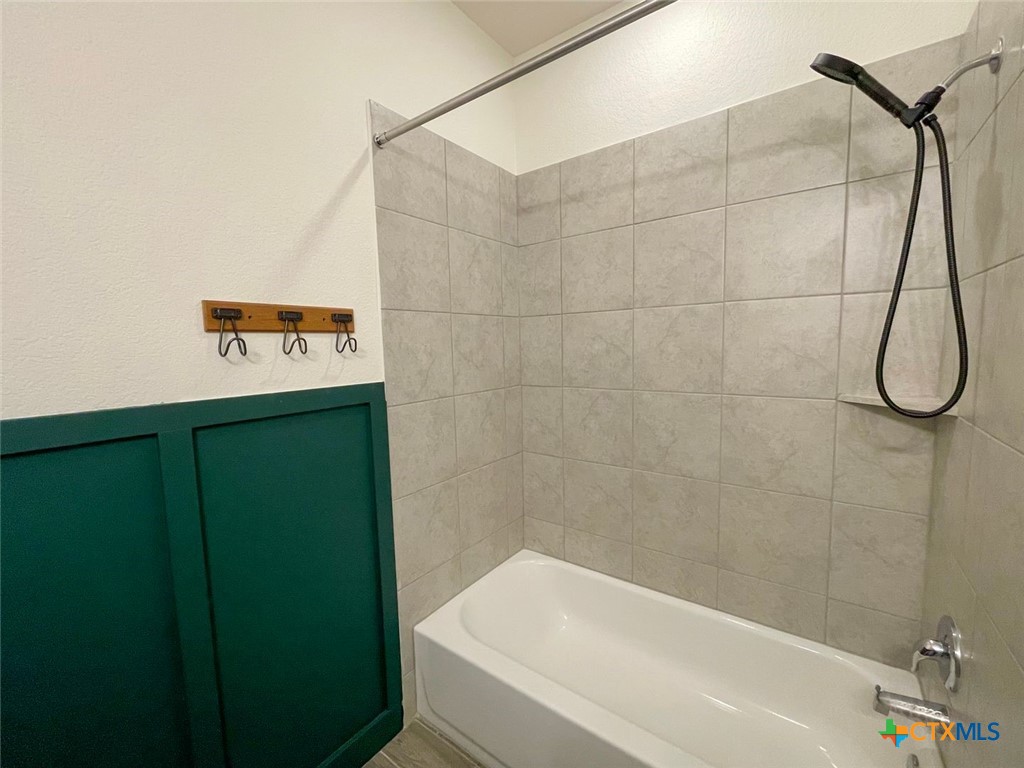 108 Old Stagecoach Road Jarrell, TX 76537 - Photo 16 of 45 a bathroom with a shower and a bath tub