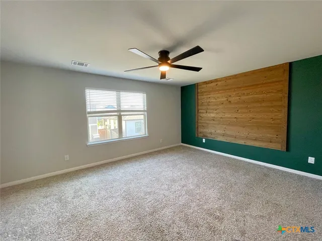 a view of empty room with windows