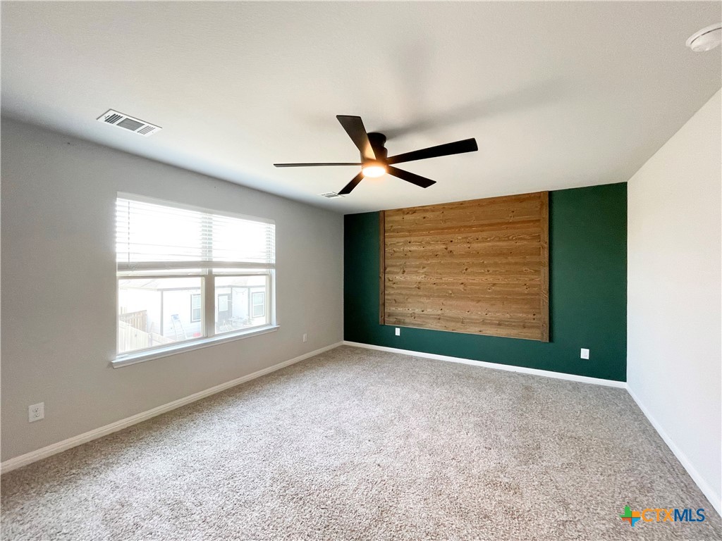 108 Old Stagecoach Road Jarrell, TX 76537 - Photo 20 of 45 a view of an empty room with window and ceiling fan
