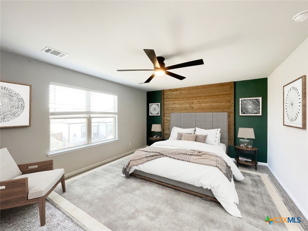 108 Old Stagecoach Road Jarrell, TX 76537 - Photo 21 of 45 a bedroom with a bed a window and mirror