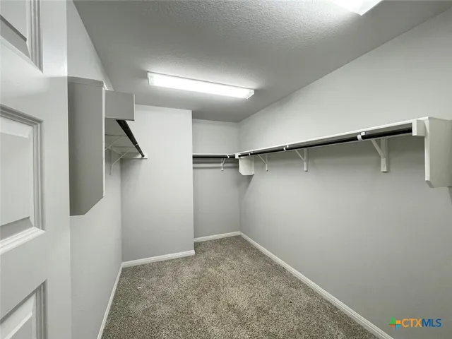 a bathroom with a double vanity sink and mirror