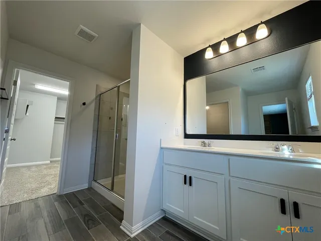 a bathroom with a shower and a toilet