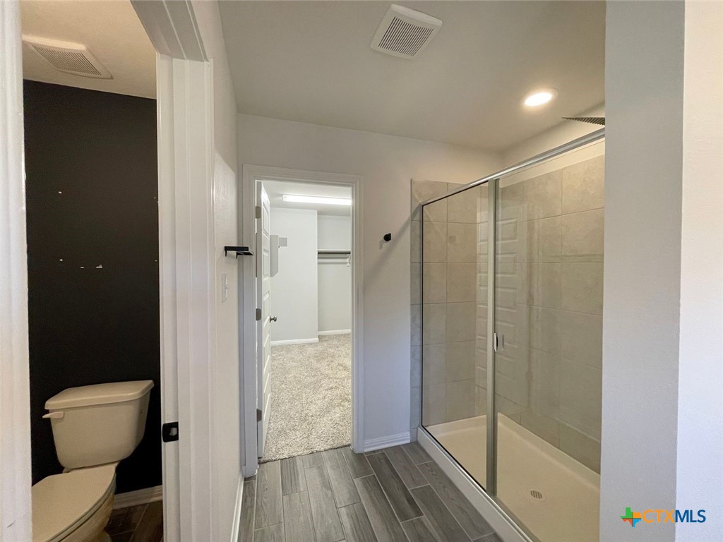 108 Old Stagecoach Road Jarrell, TX 76537 - Photo 24 of 45 a bathroom with a shower and a toilet