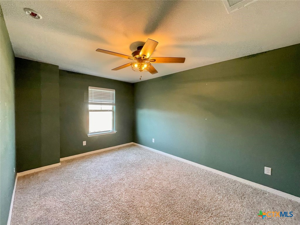 108 Old Stagecoach Road Jarrell, TX 76537 - Photo 26 of 45 a view of a livingroom with a chandelier fan and a window