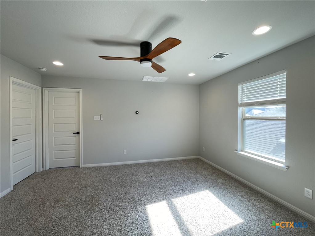 108 Old Stagecoach Road Jarrell, TX 76537 - Photo 31 of 45 an empty room with a window and ceiling fan