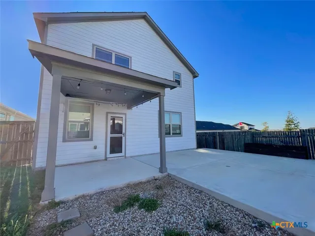 a view of a house with a patio