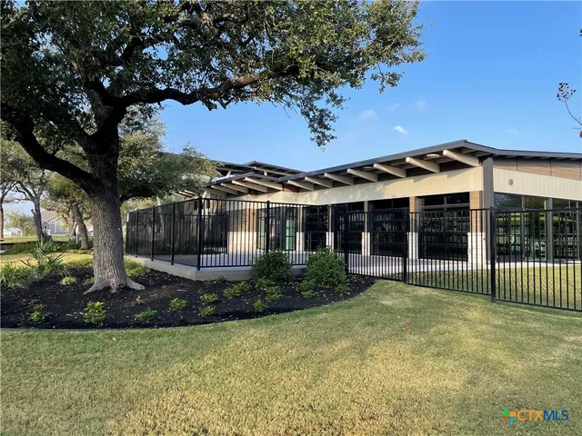 a big yard with lots of green space and palm trees