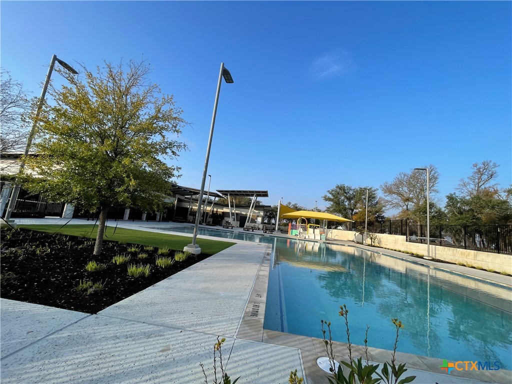 108 Old Stagecoach Road Jarrell, TX 76537 - Photo 43 of 45 a view of a swimming pool with a yard