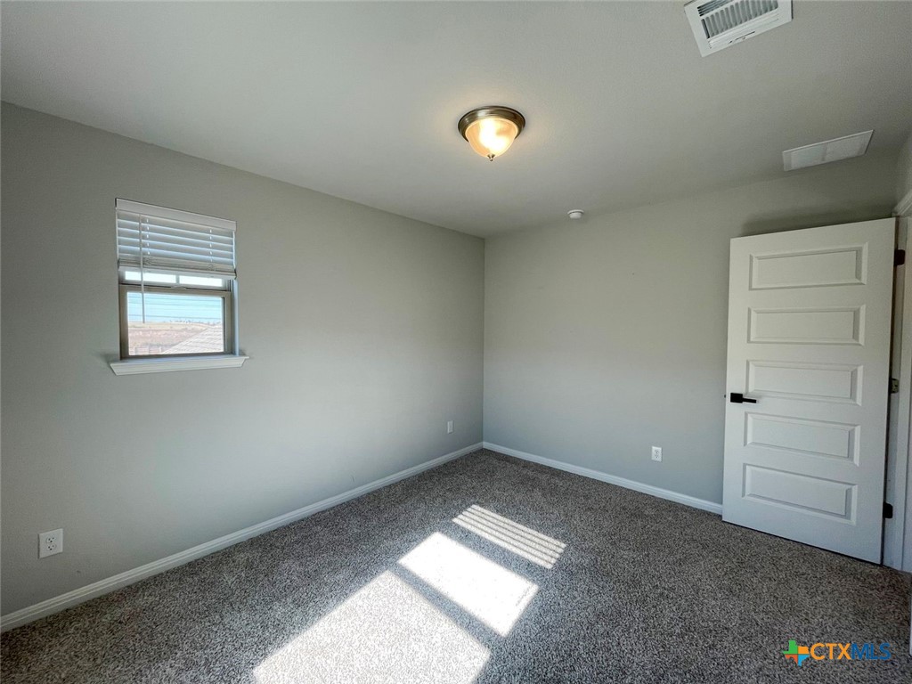 108 Old Stagecoach Road Jarrell, TX 76537 - Photo 7 of 45 an empty room with a window