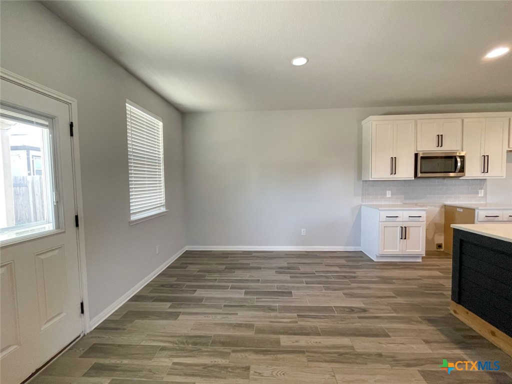 108 Old Stagecoach Road Jarrell, TX 76537 - Photo 10 of 45 a view of a kitchen with microwave and stove top oven