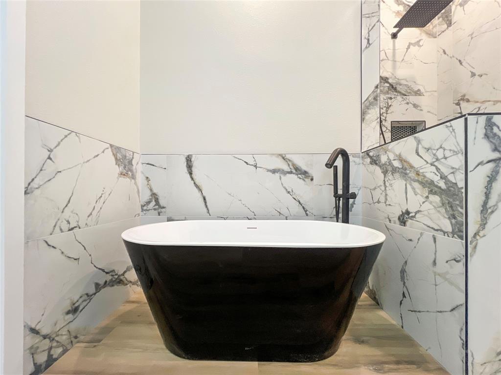 4006 Coolidge Street Dallas, TX 75215 - Photo 17 of 27 a bathroom with a sink and mirror