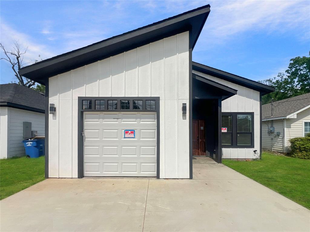 4006 Coolidge Street Dallas, TX 75215 - Photo 3 of 27 a front view of a house with a yard