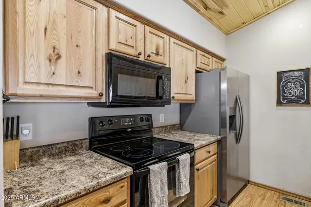 a kitchen with granite countertop a sink and a window