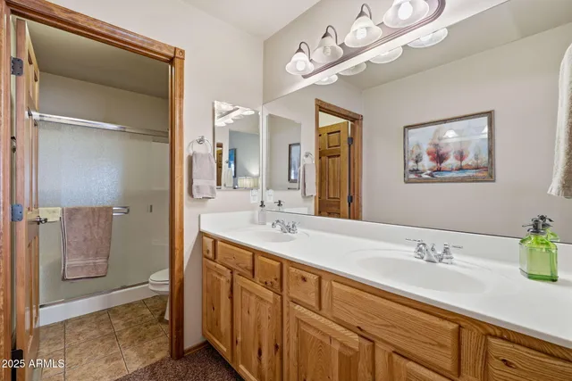 a bathroom with a shower and toilet