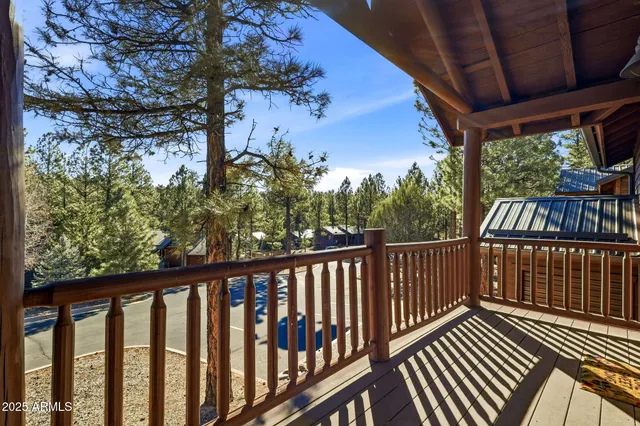 a view of a balcony with wooden floor