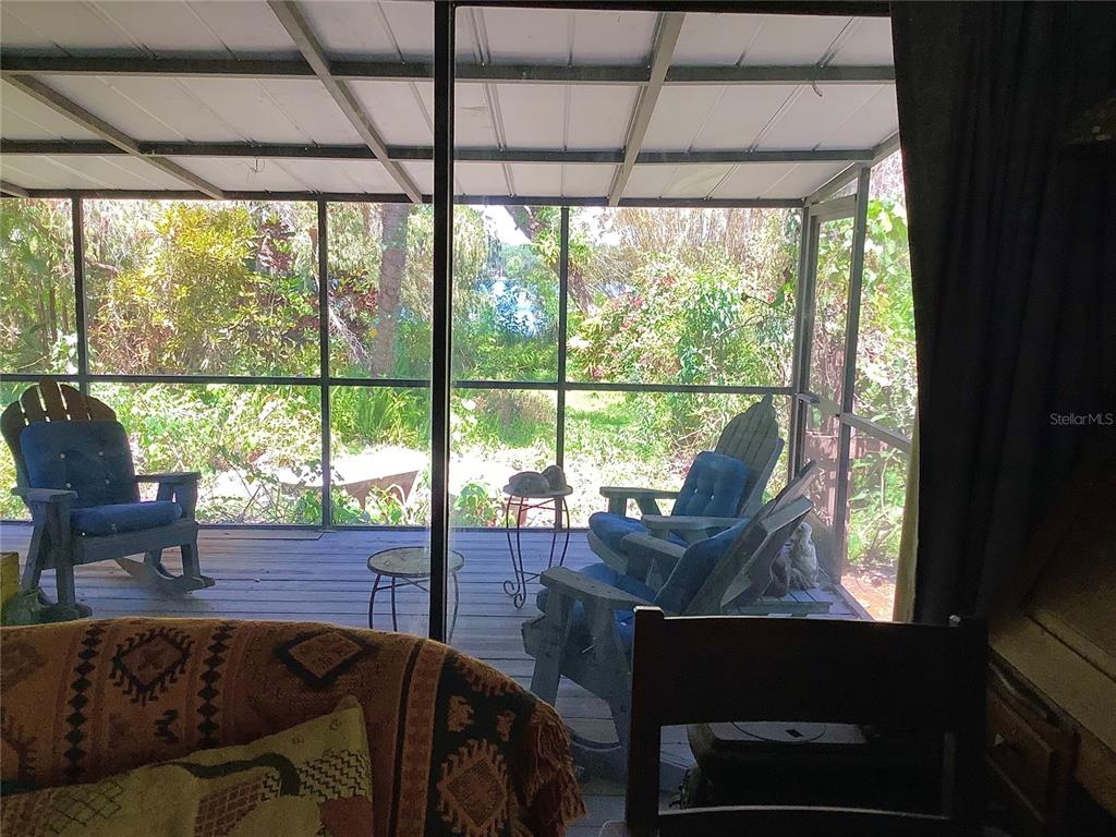 16921 Crawley Road Odessa, FL 33556 - Photo 11 of 33 a living room with furniture and a window