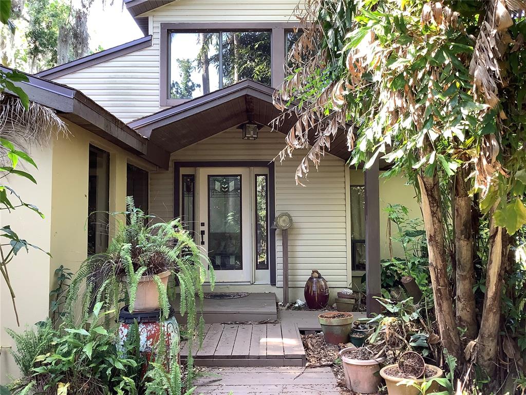 16921 Crawley Road Odessa, FL 33556 - Photo 2 of 33 a front view of a house with garden