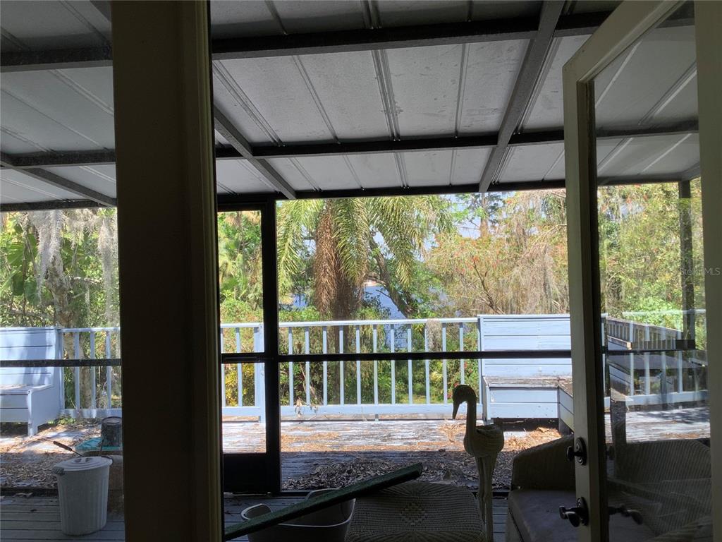 16921 Crawley Road Odessa, FL 33556 - Photo 21 of 33 a balcony view with a couple of chairs