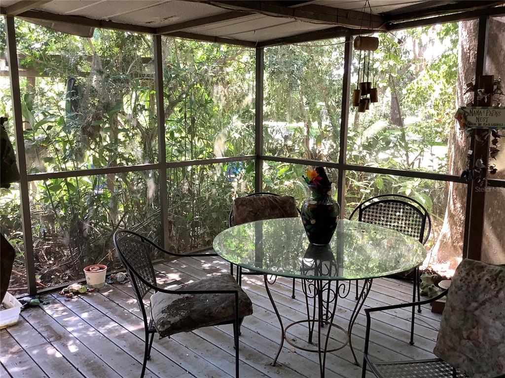 16921 Crawley Road Odessa, FL 33556 - Photo 5 of 33 a view of a dining room with furniture and window