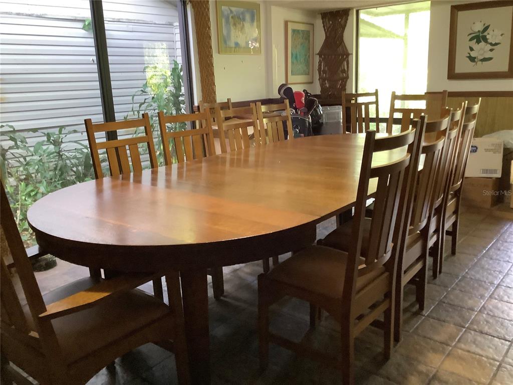 16921 Crawley Road Odessa, FL 33556 - Photo 7 of 33 a dining room with furniture and wooden floor