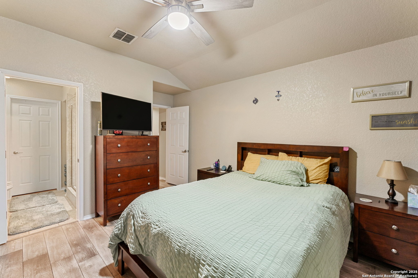 3850 Key W Way Converse, TX 78109 - Photo 14 of 24 a bedroom with a bed and a flat screen tv