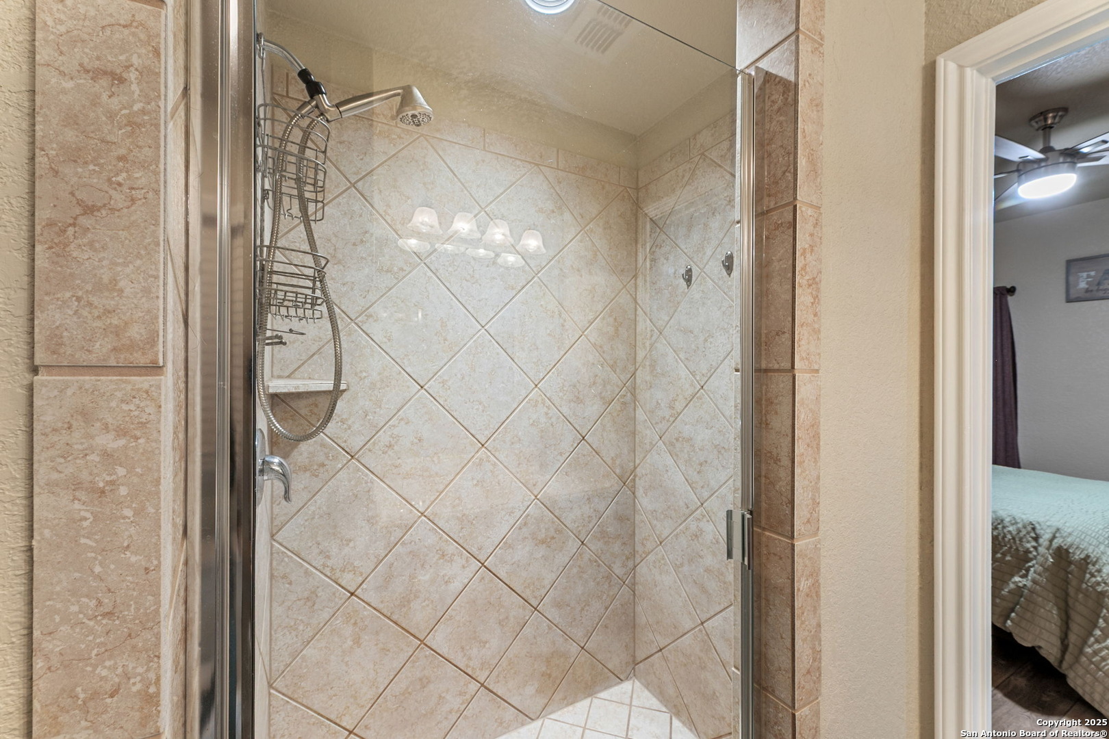 3850 Key W Way Converse, TX 78109 - Photo 19 of 24 a bathroom with a glass shower door and a bathroom