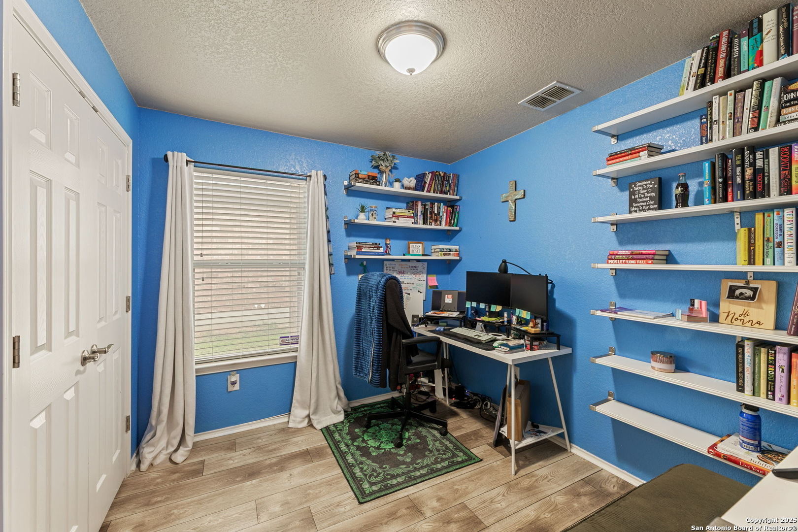 3850 Key W Way Converse, TX 78109 - Photo 20 of 24 a bedroom with furniture and a book shelf