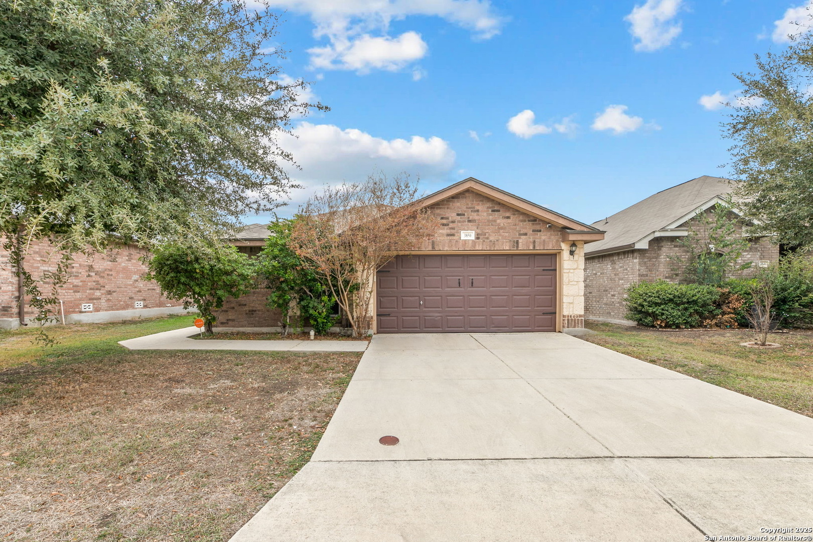 3850 Key W Way Converse, TX 78109 - Photo 3 of 24 a front view of a house with a yard and garage