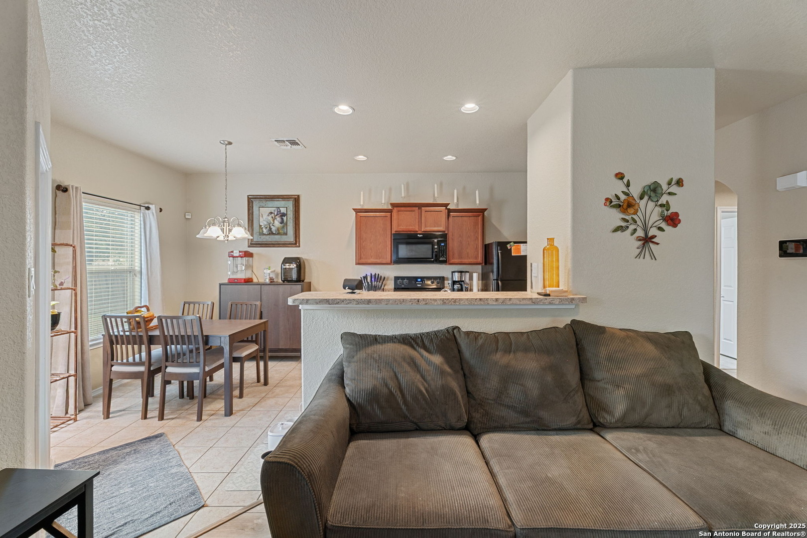 3850 Key W Way Converse, TX 78109 - Photo 9 of 24 a living room with furniture and kitchen view
