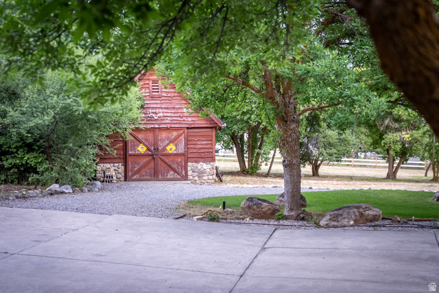 435 Canyon Road Millville, UT 84326 - Photo 51 of 113 Redwood-sided barn with a stone foundation and dual wooden doors