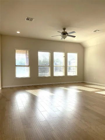 a view of a room that has a window in it