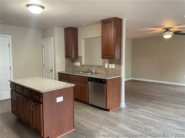 a kitchen with a stove and a sink