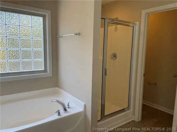 a white bath tub sitting next to a window