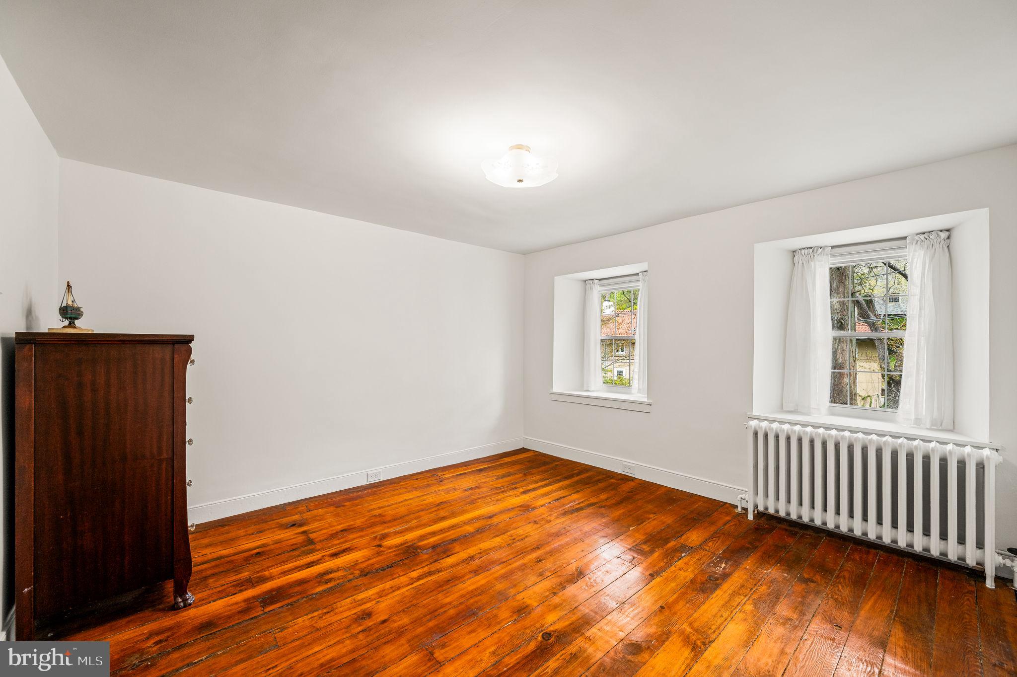 73 West Rose Valley Road Rose Valley, PA 19086 - Photo 14 of 38 a view of empty room with wooden floor and fan