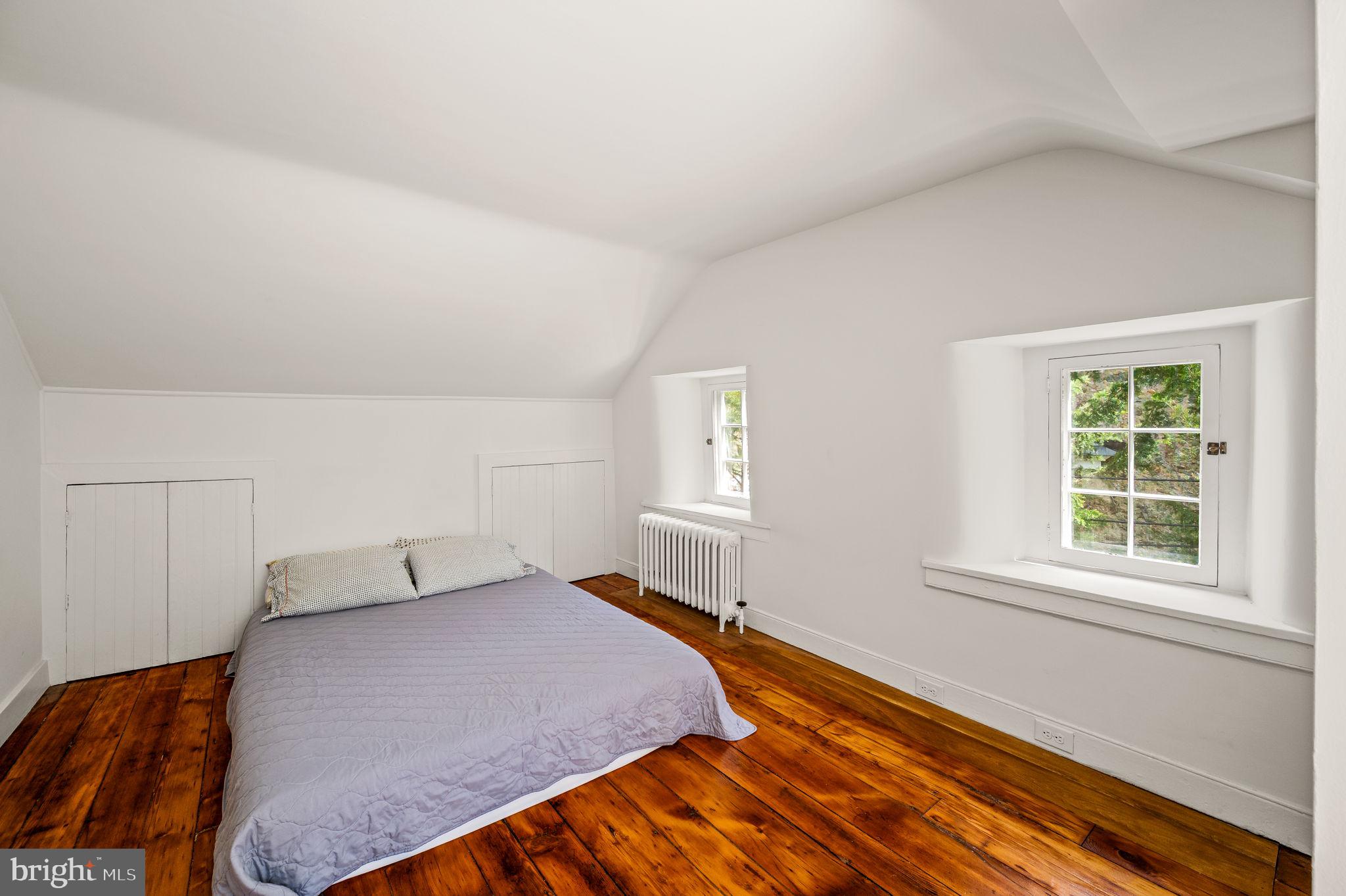 73 West Rose Valley Road Rose Valley, PA 19086 - Photo 22 of 38 a bedroom with a bed and window